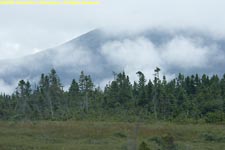 clouds in front of mountain